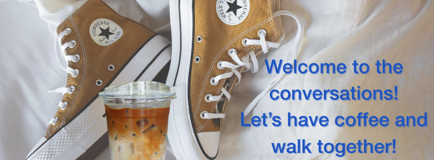 tan converse on a white sheet with a cup of ice coffee.